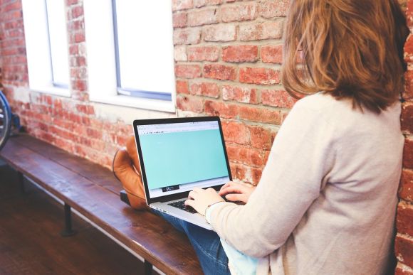 Young woman working on a laptop. Young woman working on a laptop.